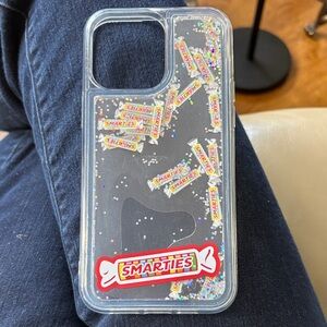 NWT Clear I-Phone 16 Plus Case with Glitter Accents Smarties Candies all over it